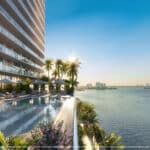 Side view of the pool overlooking the bay at La Baia North, new Miami residences for sale in Bay Harbor Islands.